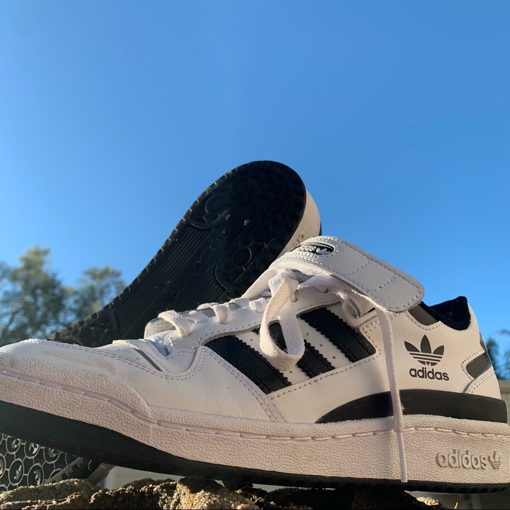 Adidas Forum Low Rise sneakers in black and white. Size 7 mens, so size 9 womens